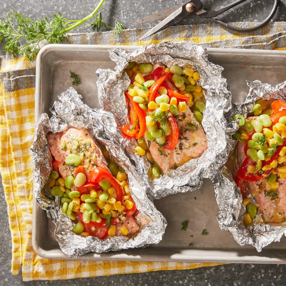 One of our make-ahead meals, the salmon foil pack, prepared on a pan.