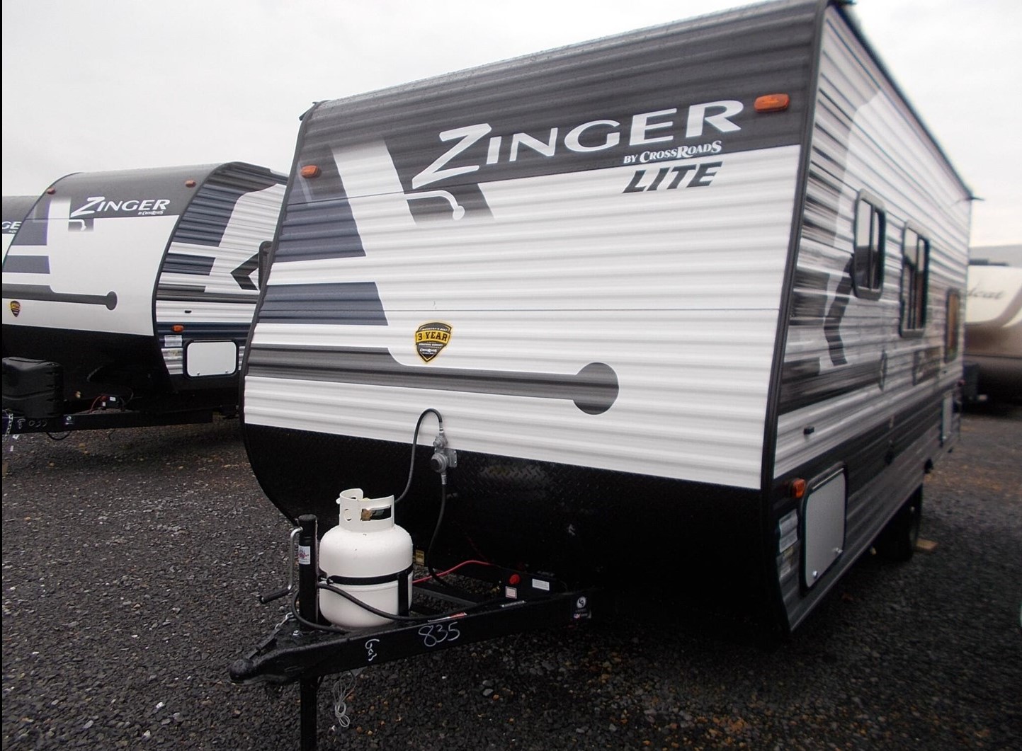 A Zinger Lite by CrossRoads, one of our tiny camper manufacturers, on the lot at our dealership.