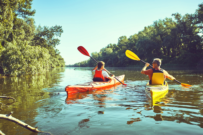 Two people take a kayak trip in the river after renting kayaks from campgrounds in Hershey, PA. 