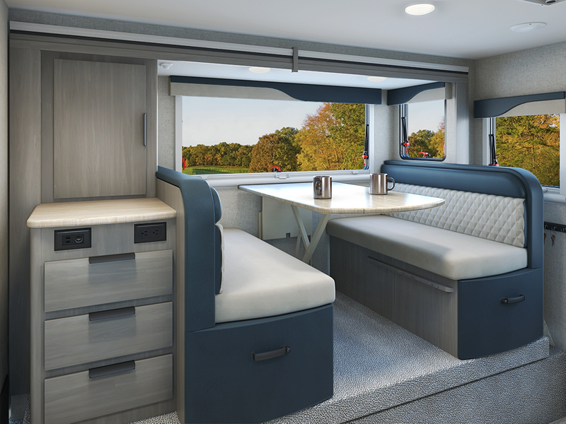 A dinette setting inside of a new Lance truck camper.